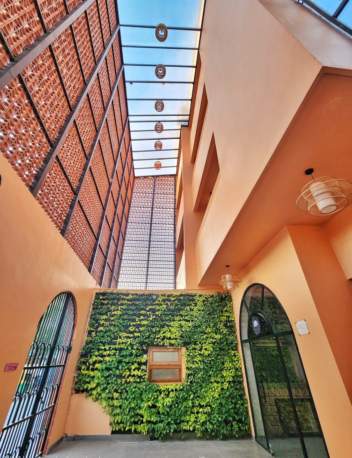 Nidra Niwas courtyard with jali skylight and green wall