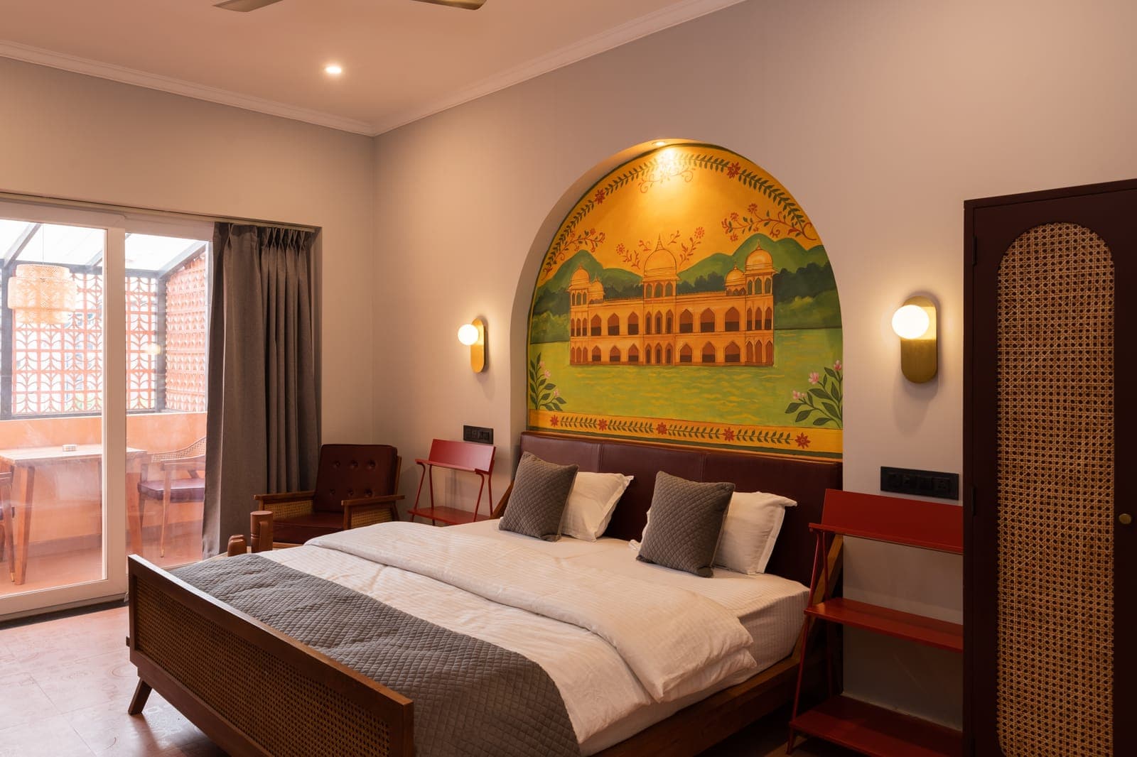 Superior room with hand-painted Rajasthani mural — boutique hotel in Jaipur